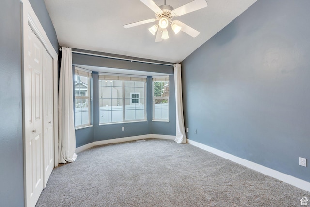 253 Ridge Rd, Orem, UT 84057 - unfurnished bedroom with vaulted ceiling, baseboards, a closet, ceiling fan, and carpet floors