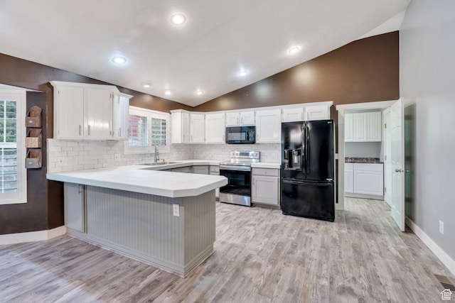 253 Ridge Rd, Orem, UT 84057 - kitchen with a peninsula, a sink, light wood-style floors, backsplash, and black appliances