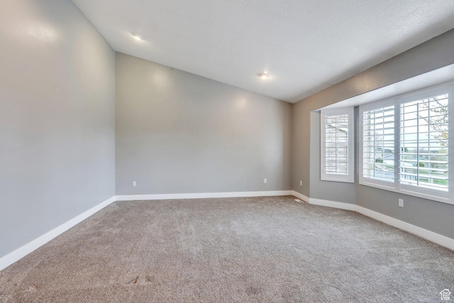 253 Ridge Rd, Orem, UT 84057 - unfurnished room with vaulted ceiling, carpet flooring, and baseboards