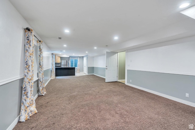 253 Ridge Rd, Orem, UT 84057 - unfurnished living room with baseboards, carpet flooring, visible vents, and recessed lighting