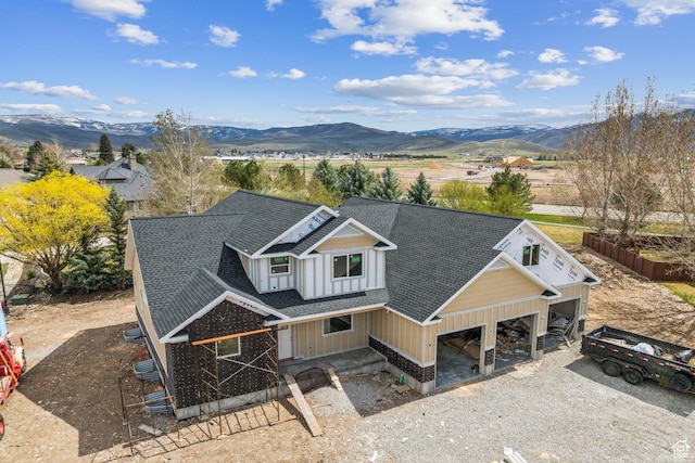 drone / aerial view featuring a mountain view
