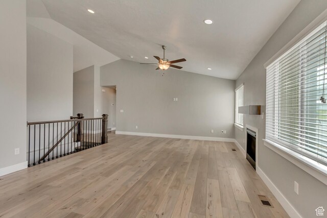 462 S 1430 E Unit 114, Tooele, UT 84074 - unfurnished living room featuring lofted ceiling, visible vents, light wood-style flooring, and ceiling fan