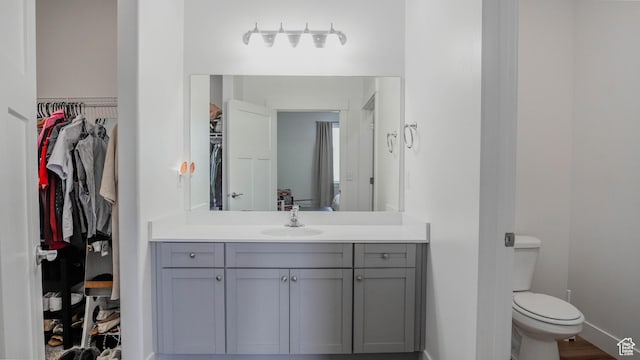 1984 N 3410 W Unit R102, Lehi, UT 84043 - bathroom with baseboards, a spacious closet, toilet, and vanity