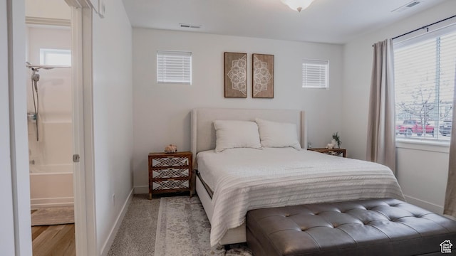 1984 N 3410 W Unit R102, Lehi, UT 84043 - bedroom featuring baseboards, multiple windows, and visible vents