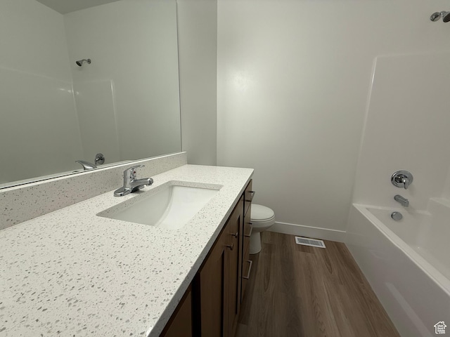1975 S Marigold Way Unit 433, Santaquin, UT 84655 - bathroom featuring wood finished floors, vanity, toilet, shower / bathtub combination, and baseboards