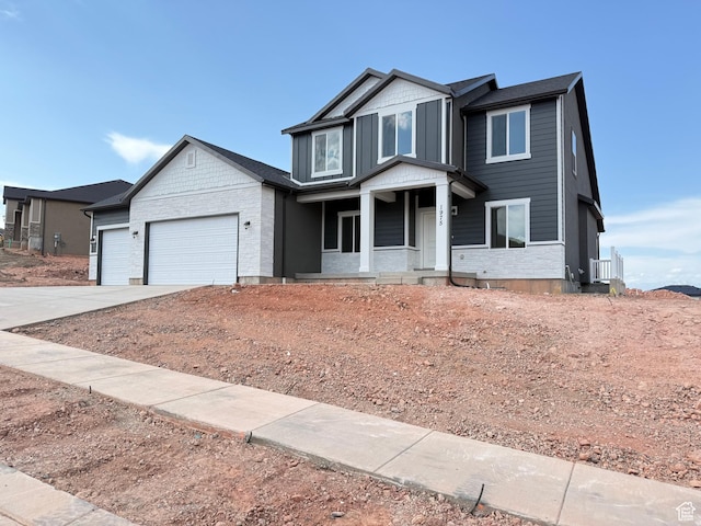 1975 S Marigold Way Unit 433, Santaquin, UT 84655 - craftsman house featuring driveway, a garage, and covered porch