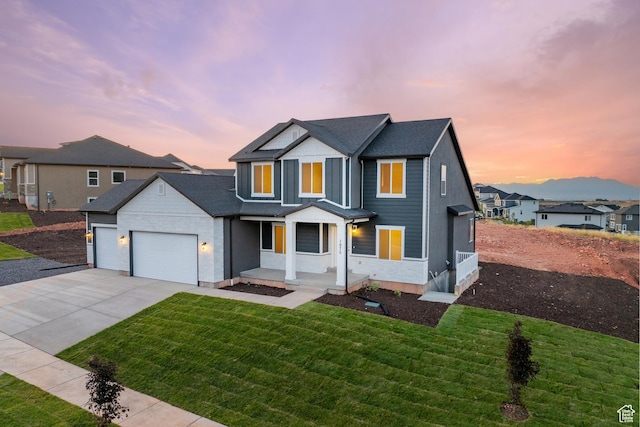 1975 S Marigold Way Unit 433, Santaquin, UT 84655 - view of front facade featuring a garage, driveway, a front lawn, a residential view, and covered porch