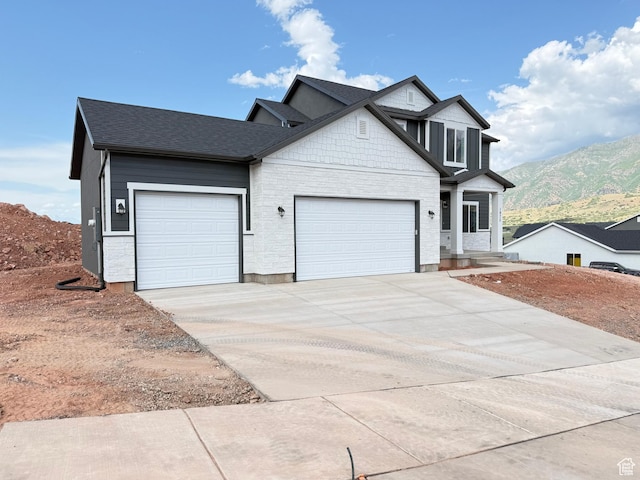 1975 S Marigold Way Unit 433, Santaquin, UT 84655 - view of front of home with a garage, driveway, a mountain view, and roof with shingles