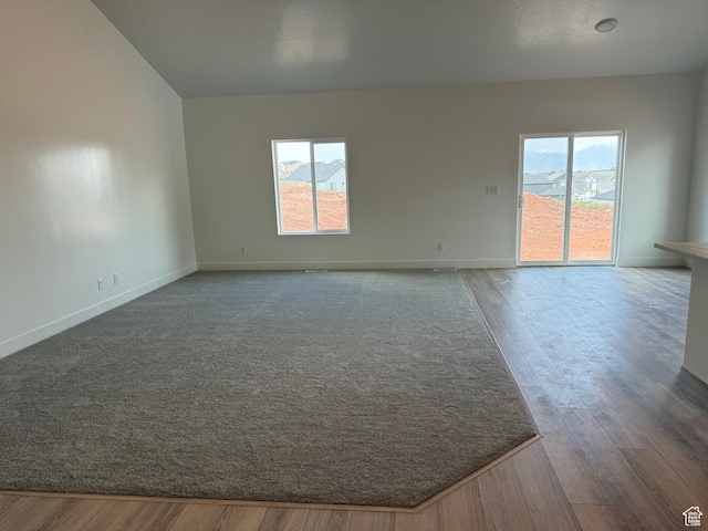 1975 S Marigold Way Unit 433, Santaquin, UT 84655 - spare room featuring plenty of natural light, wood finished floors, and baseboards