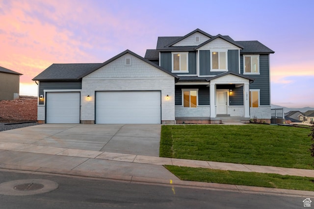 1975 S Marigold Way Unit 433, Santaquin, UT 84655 - view of front facade with a garage, a yard, concrete driveway, and a porch
