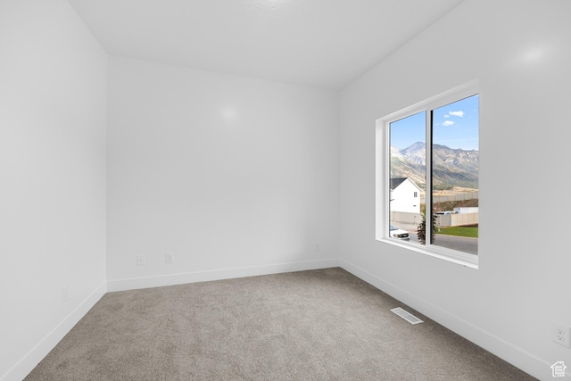 1975 S Marigold Way Unit 433, Santaquin, UT 84655 - carpeted spare room featuring baseboards and a mountain view