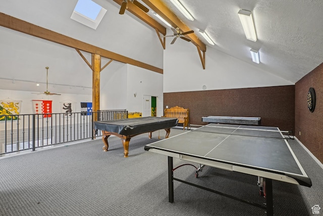rec room featuring lofted ceiling with skylight, a textured ceiling, billiards, ceiling fan, and carpet flooring