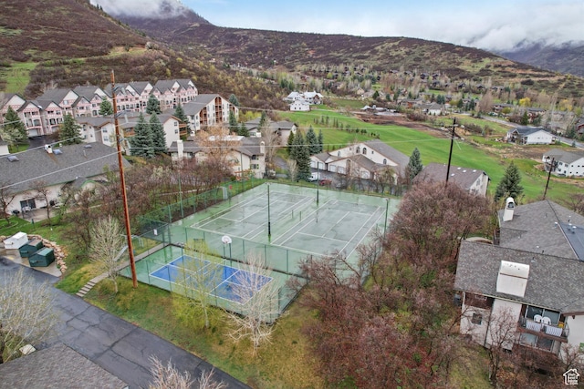 aerial view featuring a mountain view and a residential view
