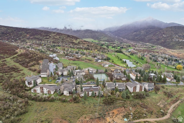 birds eye view of property with a water and mountain view and a residential view