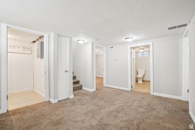 2662 Jackson Ave, Ogden, UT 84401 - unfurnished bedroom featuring ensuite bath, visible vents, carpet flooring, and baseboards