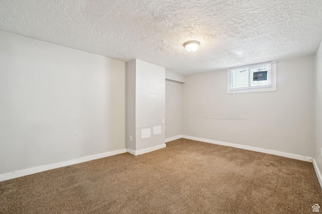 2662 Jackson Ave, Ogden, UT 84401 - basement featuring carpet, a textured ceiling, and baseboards