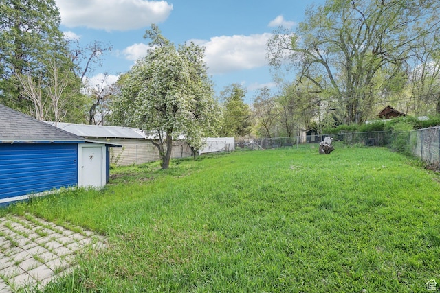 2662 Jackson Ave, Ogden, UT 84401 - view of yard with a fenced backyard and an outdoor structure