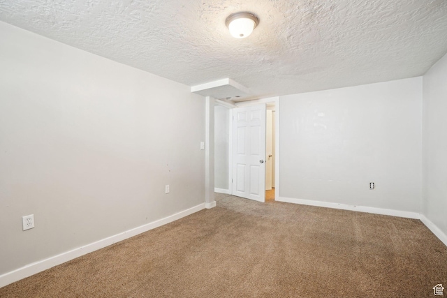 2662 Jackson Ave, Ogden, UT 84401 - carpeted spare room with baseboards and a textured ceiling