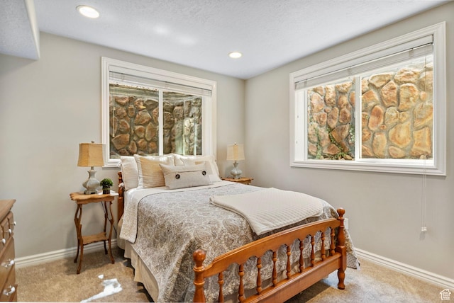 carpeted bedroom with baseboards and recessed lighting