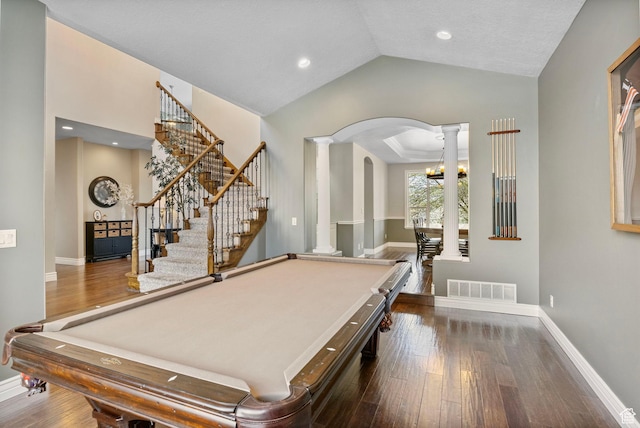 game room featuring dark wood finished floors, visible vents, arched walkways, pool table, and decorative columns