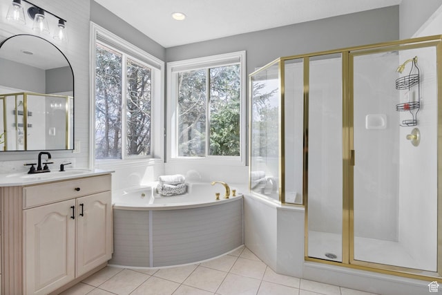 full bathroom with a garden tub, vanity, tile patterned flooring, and a stall shower