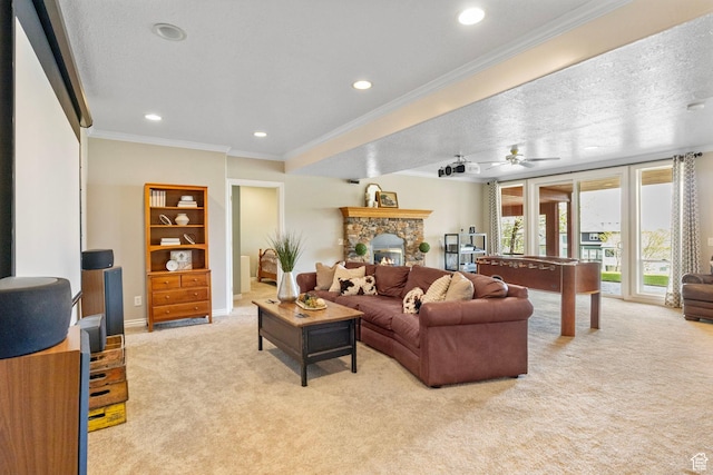 living area featuring ceiling fan, ornamental molding, recessed lighting, and light colored carpet