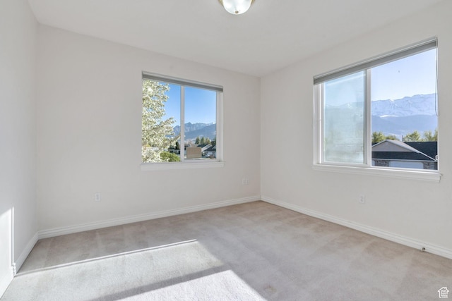 502 S 1040 E Unit 235C, American Fork, UT 84003 - empty room featuring baseboards, carpet flooring, and a mountain view