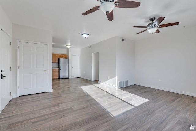 502 S 1040 E Unit 235C, American Fork, UT 84003 - unfurnished living room featuring light wood-style flooring, visible vents, and ceiling fan