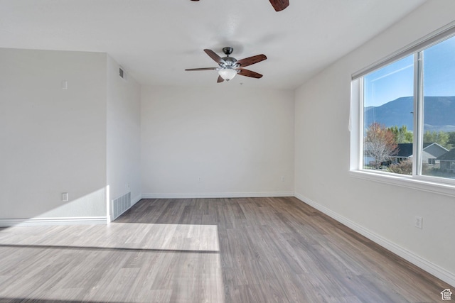 502 S 1040 E Unit 235C, American Fork, UT 84003 - spare room featuring ceiling fan, baseboards, wood finished floors, and visible vents