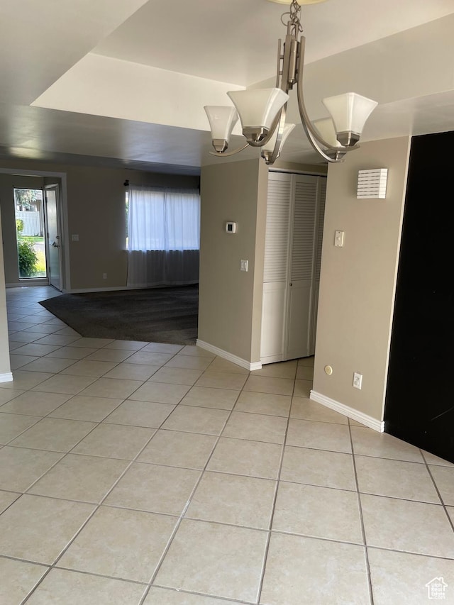 1525 E 5700 S, Murray, UT 84121 - unfurnished dining area featuring baseboards, an inviting chandelier, and light tile patterned floors