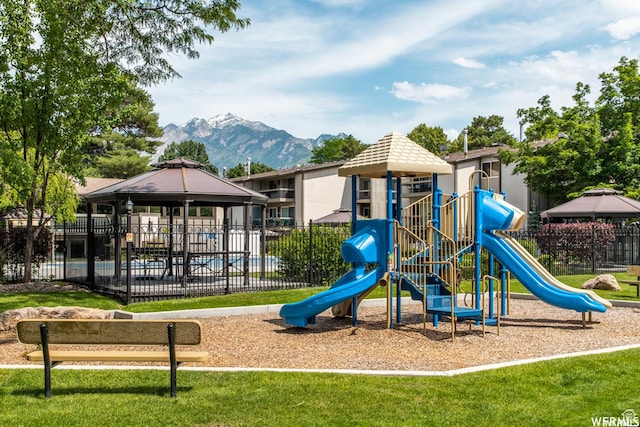 1525 E 5700 S, Murray, UT 84121 - community play area featuring a gazebo, fence, a yard, and a mountain view