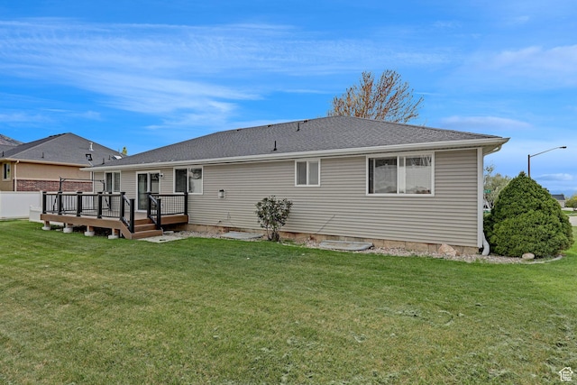 2838 N 1375 E, North Ogden, UT 84414 - back of house with a wooden deck, a lawn, and roof with shingles