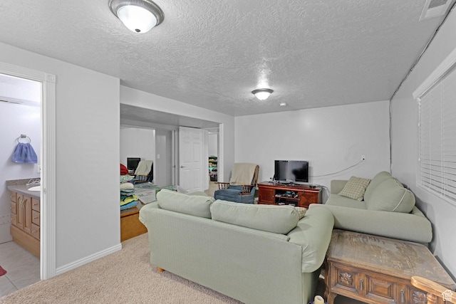 2838 N 1375 E, North Ogden, UT 84414 - living area featuring baseboards, visible vents, a textured ceiling, and light tile patterned floors