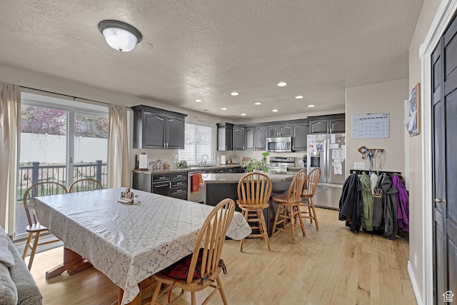 2838 N 1375 E, North Ogden, UT 84414 - dining room with recessed lighting, a textured ceiling, and light wood finished floors