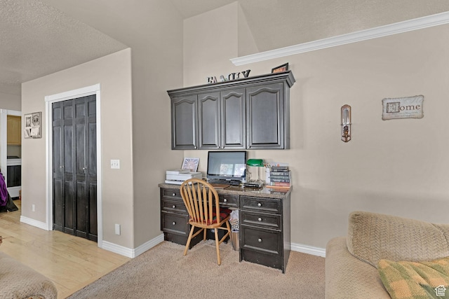 2838 N 1375 E, North Ogden, UT 84414 - home office with baseboards, light wood-style flooring, a textured ceiling, and built in desk