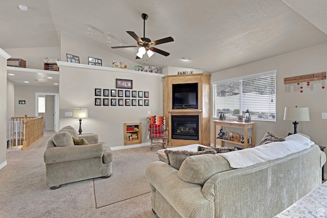 2838 N 1375 E, North Ogden, UT 84414 - carpeted living room featuring lofted ceiling, a healthy amount of sunlight, a ceiling fan, and baseboards