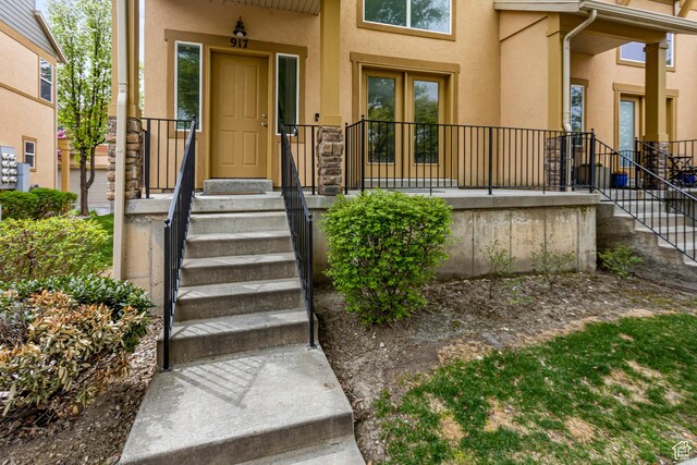 917 W Willow Bend Way, Farmington, UT 84025 - doorway to property with stone siding and stucco siding