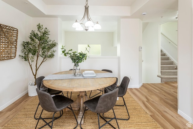 917 W Willow Bend Way, Farmington, UT 84025 - dining space with stairway, baseboards, light wood-style floors, and an inviting chandelier