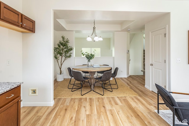 917 W Willow Bend Way, Farmington, UT 84025 - dining room featuring stairway, light wood finished floors, a raised ceiling, baseboards, and a notable chandelier