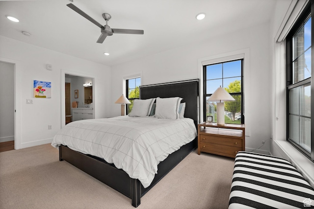 carpeted bedroom with recessed lighting, a ceiling fan, baseboards, and ensuite bathroom