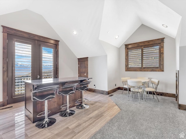 15146 S Secret Canyon Cir, Herriman, UT 84096 - interior space featuring lofted ceiling, visible vents, baseboards, and light wood-type flooring