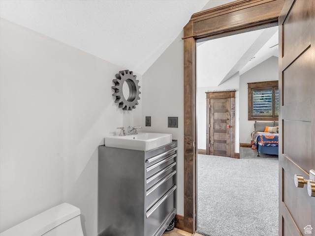 15146 S Secret Canyon Cir, Herriman, UT 84096 - bathroom with lofted ceiling, toilet, and vanity