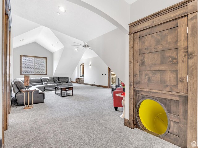 15146 S Secret Canyon Cir, Herriman, UT 84096 - carpeted living area featuring vaulted ceiling, a ceiling fan, arched walkways, baseboards, and recessed lighting