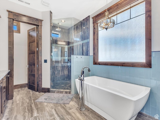 15146 S Secret Canyon Cir, Herriman, UT 84096 - full bath featuring a wealth of natural light, vanity, an inviting chandelier, and a stall shower