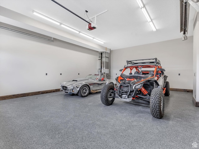 15146 S Secret Canyon Cir, Herriman, UT 84096 - garage featuring a garage door opener and baseboards