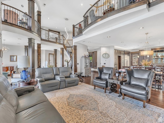 15146 S Secret Canyon Cir, Herriman, UT 84096 - living area with stairway, wood finished floors, a high ceiling, visible vents, and recessed lighting