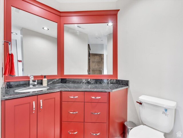 15146 S Secret Canyon Cir, Herriman, UT 84096 - bathroom featuring double vanity, visible vents, toilet, and a sink