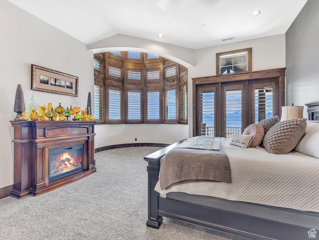 15146 S Secret Canyon Cir, Herriman, UT 84096 - carpeted bedroom featuring visible vents, baseboards, a glass covered fireplace, recessed lighting, and lofted ceiling