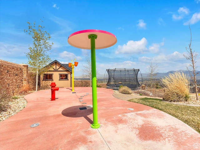 15146 S Secret Canyon Cir, Herriman, UT 84096 - surrounding community featuring fence, a patio area, a mountain view, and a trampoline