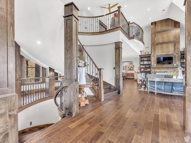 15146 S Secret Canyon Cir, Herriman, UT 84096 - stairway featuring hardwood / wood-style flooring, a towering ceiling, and recessed lighting